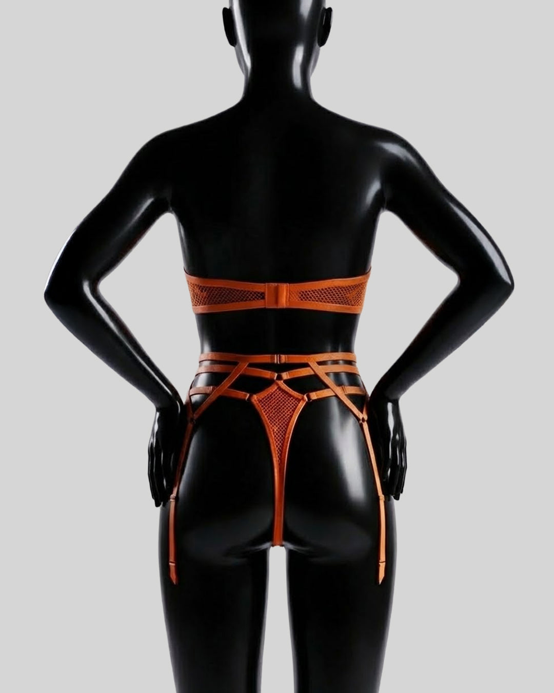 Amber Obsession – Strappy Mesh Bodysuit with Garters